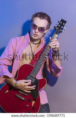 Portrait of the Man with the Guitar. Vertical image