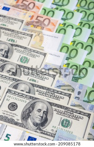 World Currency Concept: Closeup of European and the US Hard Currencies Together. Vertical Image Composition