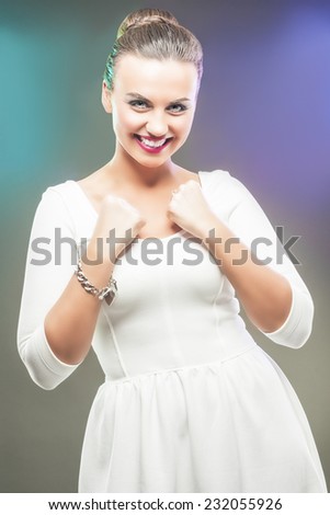 Portrait of Caucasian Brunette Woman Showing Emotional Excitement with Lifted Hands. Vertical Image Composition