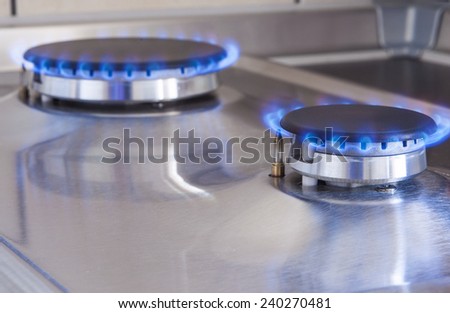 Closeup Shot of Two Gas Burners In Line Located on Kitchen Stove. Horizontal Image Composition