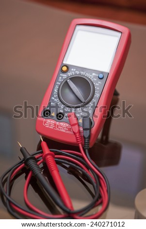 Engineering Measure Unit With Two Connected Probes of Red and Black Color for Indication. Vertical Image Composition