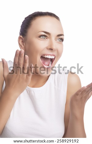 Emotions Concept: Portrait of Excited Caucasian Brunette Female Showing Positive Facial Expression. Isolated Over Pure White. Vertical Shot