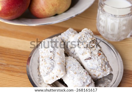 Homemade Tasty Milk Cookies with Cream Dressings and Condensed Milk Filling against of Glass of Milk on Wooden Background. Horizontal Image
