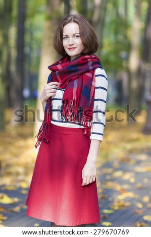 Fashion and Style Concept: Portrait of Young Caucasian Brunette Female in Made to Measure Clothing. Outdoors Photoshot. Vertical image