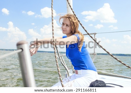 Dreaming Caucasian Female Traveling Under Sale and Sitting on Handrails. Horizontal  Image Orientation