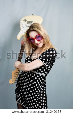 blonde with guitar smiling isolated