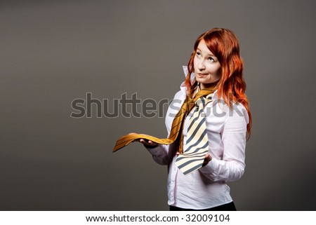 young woman holding tie isolated