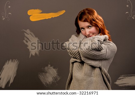 smiling red haired girl with lifted arms isolated