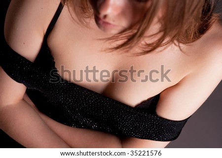 pretty bossom of young blonde female top view isolated on gray