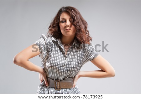 young and sensual caucasian brunette girl standing posing over white background with body shaped