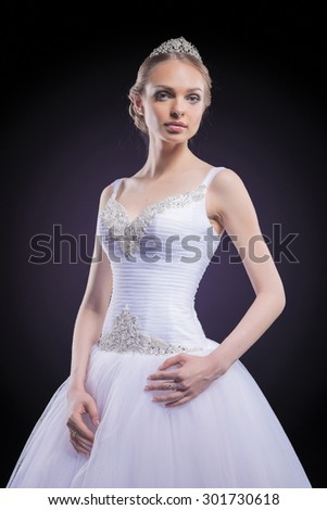 Caucasian female costume designer works on wedding gown - Stock Image -  Everypixel