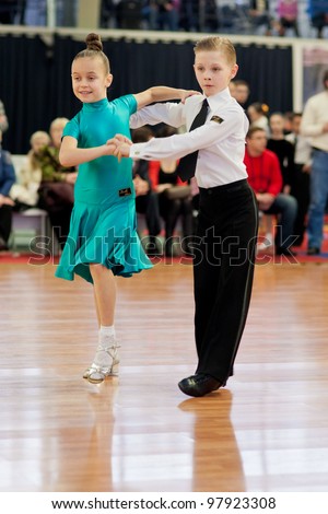 MINSK-BELARUS, MARCH 4: an Unidentified Dance Couple performs Junior Latin-American Program on The Republic of Belarus WDSF Championship, 2 Stage, on March 4, 2012 in Minsk,The Republic of Belarus