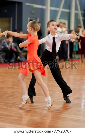 MINSK-BELARUS, MARCH 4: an Unidentified Dance Couple performs Junior Latin-American Program on The Republic of Belarus WDSF Championship, 2 Stage, on March 4, 2012 in Minsk,The Republic of Belarus