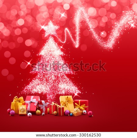 Christmas tree made of sparkles and lights with gifts and baubles on red background