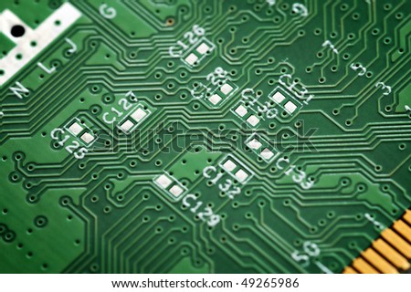 Close up of a green circuit board without components.