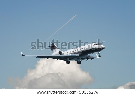 Large double engine business jet landing