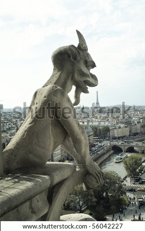 Panoramic of Paris with Gargoyle architectural fragment in foreground, taken from the roof of Cathedral Notre Dame