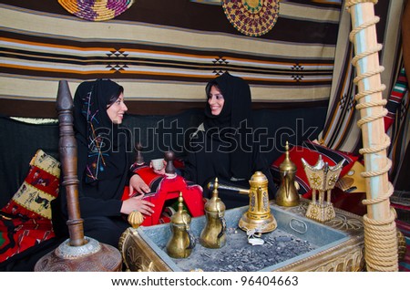 Arab Women sitting in a traditional tent