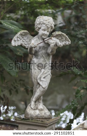 Cupid Statue sculpture in the garden.