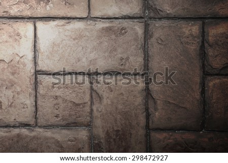 Stone Tile Cement Brick Wall Background Texture with Lighting from Above side.