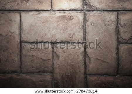 Stone Tile Cement Brick Wall Background Texture with Lighting from Above.