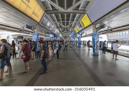BANGKOK, THAILAND - September 12, 2015: Peoples standing in lines waiting for BTS sky train at Siam station in rush hour on September 12, 2015 in Bangkok Thailand.