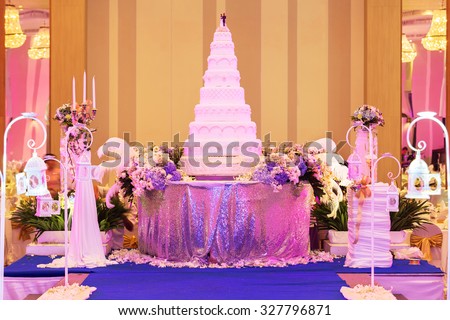 Wedding cake and decorations on stage in wedding ceremony. - (Shallow of focus)