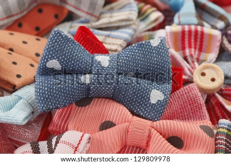 Bow ties and hair bows pile