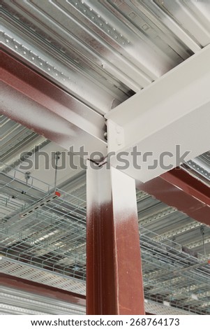 A detail of a metal decking and universal column and universal beam connected, materials are sprayed with intumescent paint