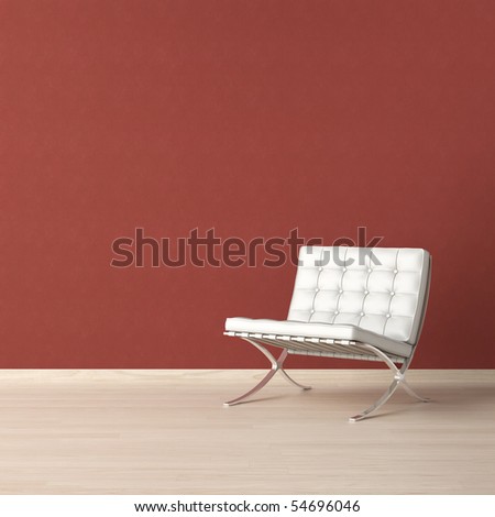 White leather chair on a red wall with copy-scape on the top left corner