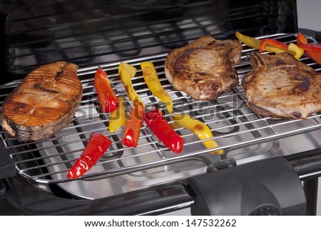 Meat and fish on the grill