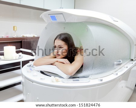 young beautiful woman at steam SPA capsule - beauty treatment woman at steam SPA capsule - beauty treatment