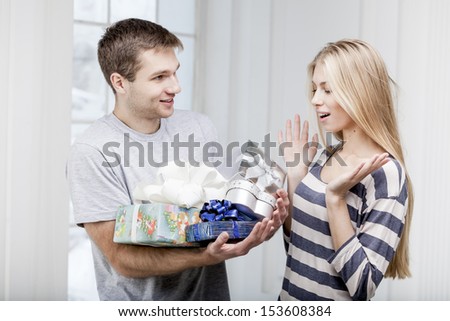 man giving presents to a young beautiful woman
