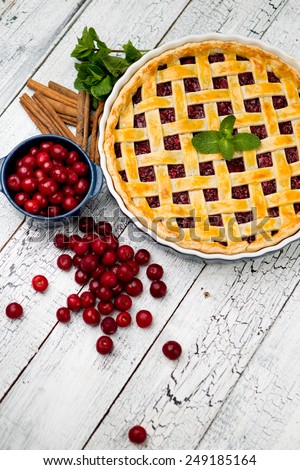 Homemade cherry pie on wooden table. Elevated view