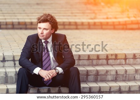 Handsome mature caucasian businessman outdoor wearing suit