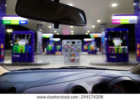 Looking out the car window to see gas station,use for product presentation\
related Images.