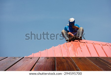 Workers are roofed with corrugated steel metal sheet,use as a background or use for product presentation related images.