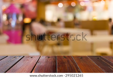 Blurred blue and pink  food court in the mall background scene or use for product presentation related images.