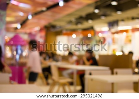 Blurred blue and pink  food court in the mall background scene.