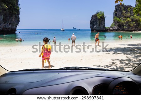 Look out the car window , Blur people play on the beach,use for background.