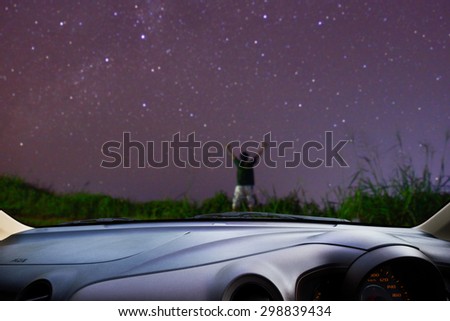 Look out the car window , Blur of image a men was happy to see many stars, use for background.