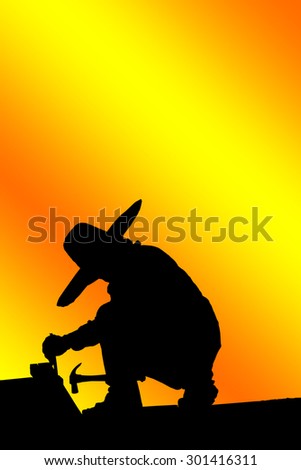 Construction worker silhouette at work.