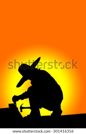 Construction worker silhouette at work.
