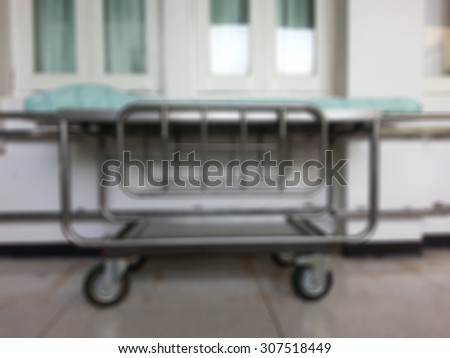 Blur of moving patient beds in hospitals.