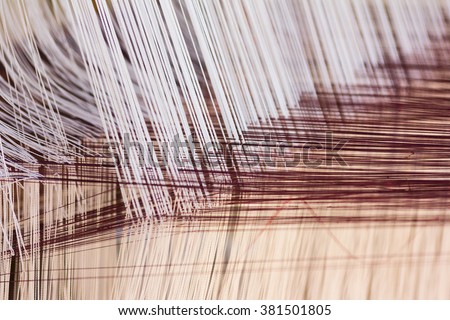 Thread from weaving machine, Abstract background - selective focus.