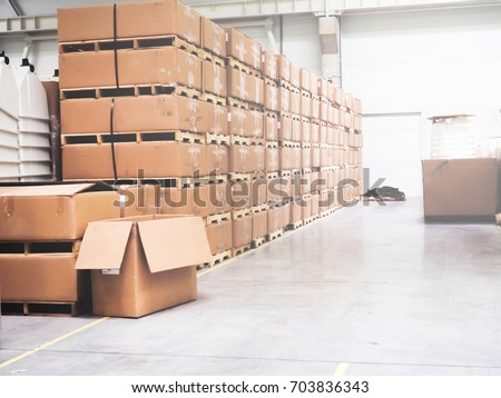 Warehouse industrial premises for storing materials and wood, there is a forklift for containers. Concept logistics, transport. ot of boxes in the warehouse