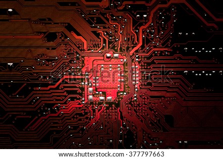 Closeup electronic circuit board \
background.