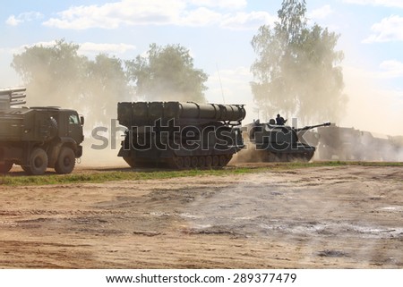 KUBINKA, MOSCOW REGION, RUSSIA - JUNE 18, 2015. The exhibition Army 2015. Dislocation of Russian heavy weapons. Launcher of the S-300V anti-air missile complex, howitzer \