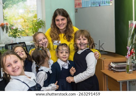 MOSCOW OCTOBER 3 - Alternate teacher Maria Pekanova with unidentified students of Junior class after the lesson. Teachers\' Day in Moscow school October 3, 2014