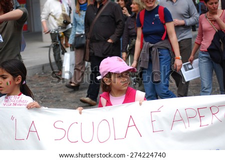 MILAN APRIL 25 - Unidentified people participate in a demonstration, unidentified children carry a banner. Festa della Liberazione in Italy April 25, 2009
